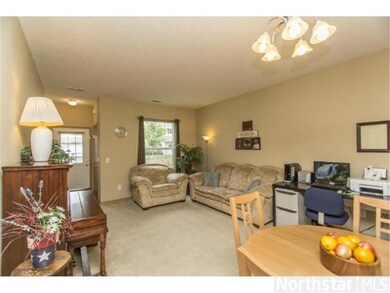 Spacious living room is bright and light.