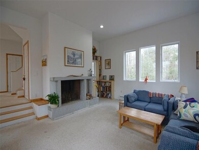 Living room with granite, wood...