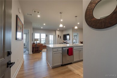 Kitchen with light hardwood / wood-style floors, d