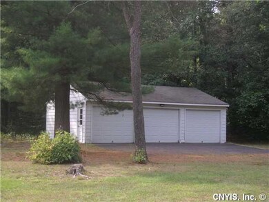 Exterior Front. BONUS - Three car detached garage.