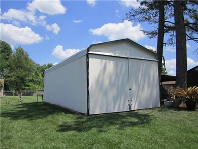 A second storage shed with gravel floor - 14 x 28 - property is fenced with privacy fence around pool!