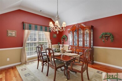 The large formal dining room offers a high vaulted
