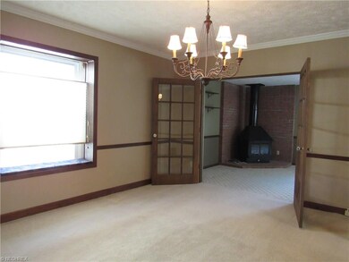 Spacious formal dining room features a cozy window