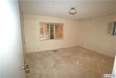 Large, corner bedroom (wallpaper removed from wall