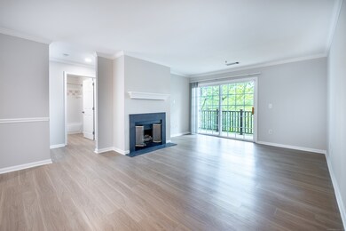 Living room with fireplace and balcony