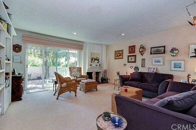 Living room w/Fireplace and doors to patio