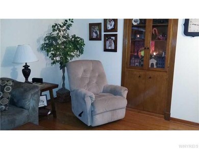Living Room. Built in wall cabinet is nice and dee