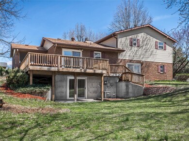 The rear of the home also includes an expansive deck off the kitchen, and lower level walkout patio.