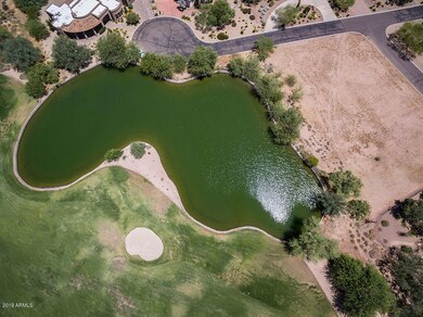 View of pond, lot and golf course