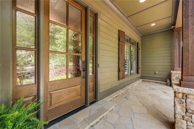Doorway to property featuring a porch