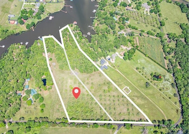 Aerial view of property's location featuring property parcel outlined and rural landscape
