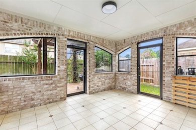 Bright and inviting solarium with brick walls and