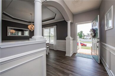 Spacious foyer welcomes you with beautiful chair rail, picture-frame moulding, and leads you into a dining room you will love to plan dinner parties for!
