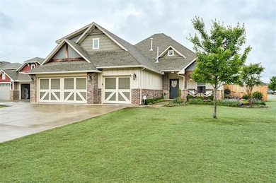 Craftsman-style home featuring driveway, a front lawn, roof with shingles, board and batten siding, and an attached garage