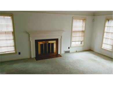 Coved ceiling and hardwood floor under carpet.