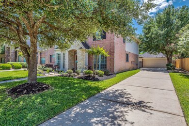 Extra long driveway leading to the detached garage provides ample parking for guests.