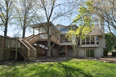 Rear of house with covered outdoor porch and walk 