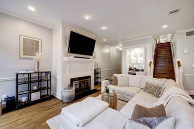 View of living room with fireplace, wet bar and st
