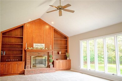 Great room with gas fireplace, built-in shelves an