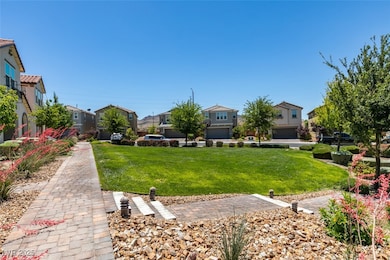 View of green lawn with a residential view