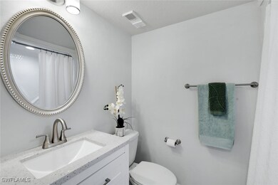 Bathroom #2 featuring vanity, toilet and tub/showe