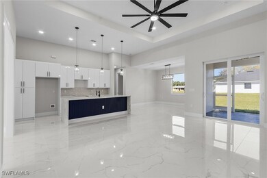 Unfurnished living room with a ceiling fan, basebo