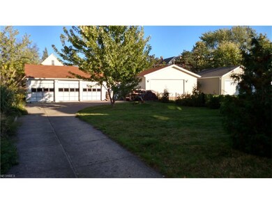 Three car garage is in great shape, has electricity and new concrete floor/sill.