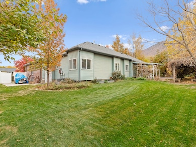 Back of property with a yard