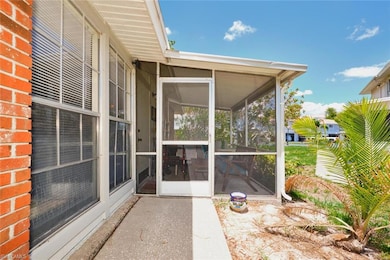 View of patio / terrace with a sunroom