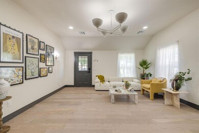 Living room with vaulted ceiling, an inviting chan