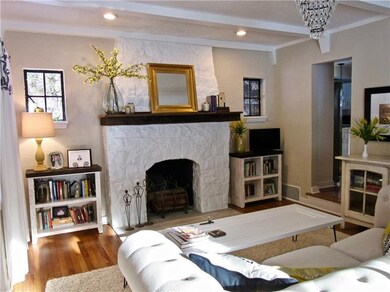 Charming living room with decorative stone firepla