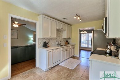 Updated Kitchen with solid surface counters and su
