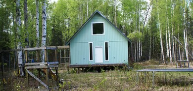 front of hom with swing set tramapline