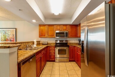 Kitchen with appliances with stainless steel finis