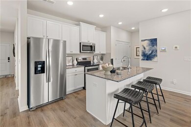 Kitchen with appliances with stainless steel finis