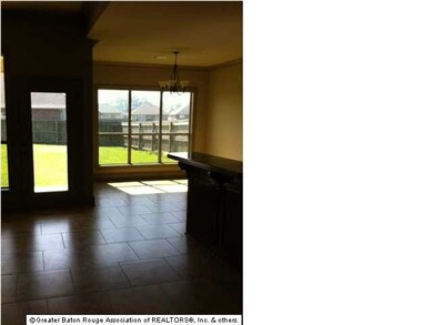 OPEN LIVING AREA/KITCHEN OVERLOOKING BACKYARD
