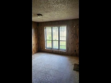 Spare room featuring a textured ceiling