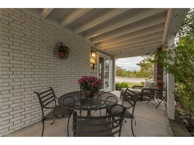 A close-up of the side porch.  Porch is accessible from the backyard, front yard and via two french doors off of the living room.