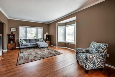 Living room is HUGE, filled with natural light and