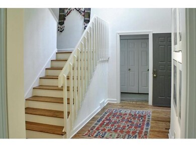 Stairway in the front entry way...high ceiling giv