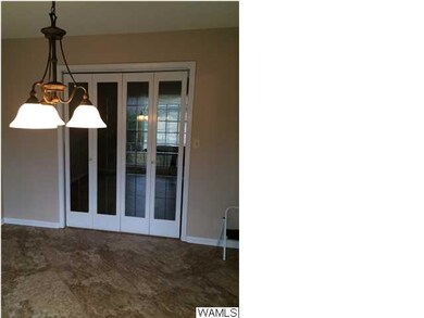 French doors separating dining from formal living