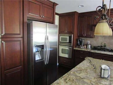 Another view of kitchen and appliances