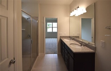 Master Bathroom with Double Sink Vanity and Glass Enclosed Shower