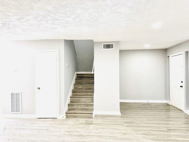 Wide, welcoming stairs lead you to the second floo