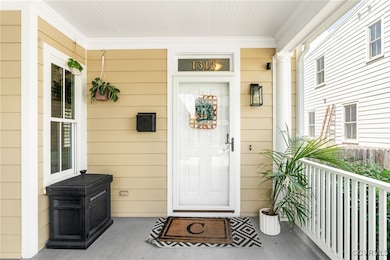 Property entrance featuring covered porch