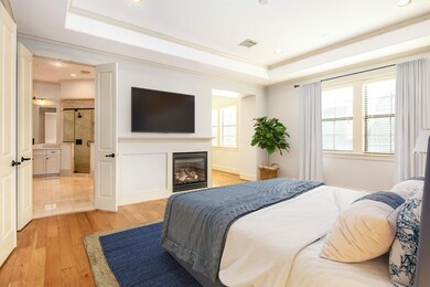 Spacious primary suite with fire place, on the 2nd floor. Virtually staged.