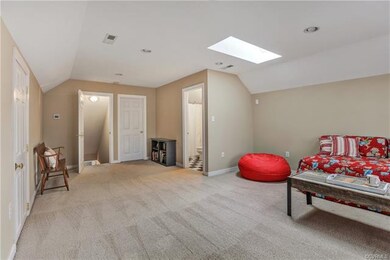 Another view of the third floor rec room.  The walk in attic is very spacious and off this room.