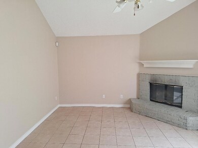 Unfurnished living room featuring lofted ceiling, 