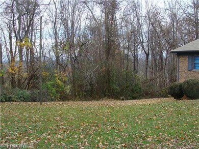 Exterior Front. Front Yard with Distant Mountain Views
