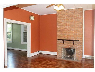 Living Room. High Ceilings, Exposed Brick Fireplac